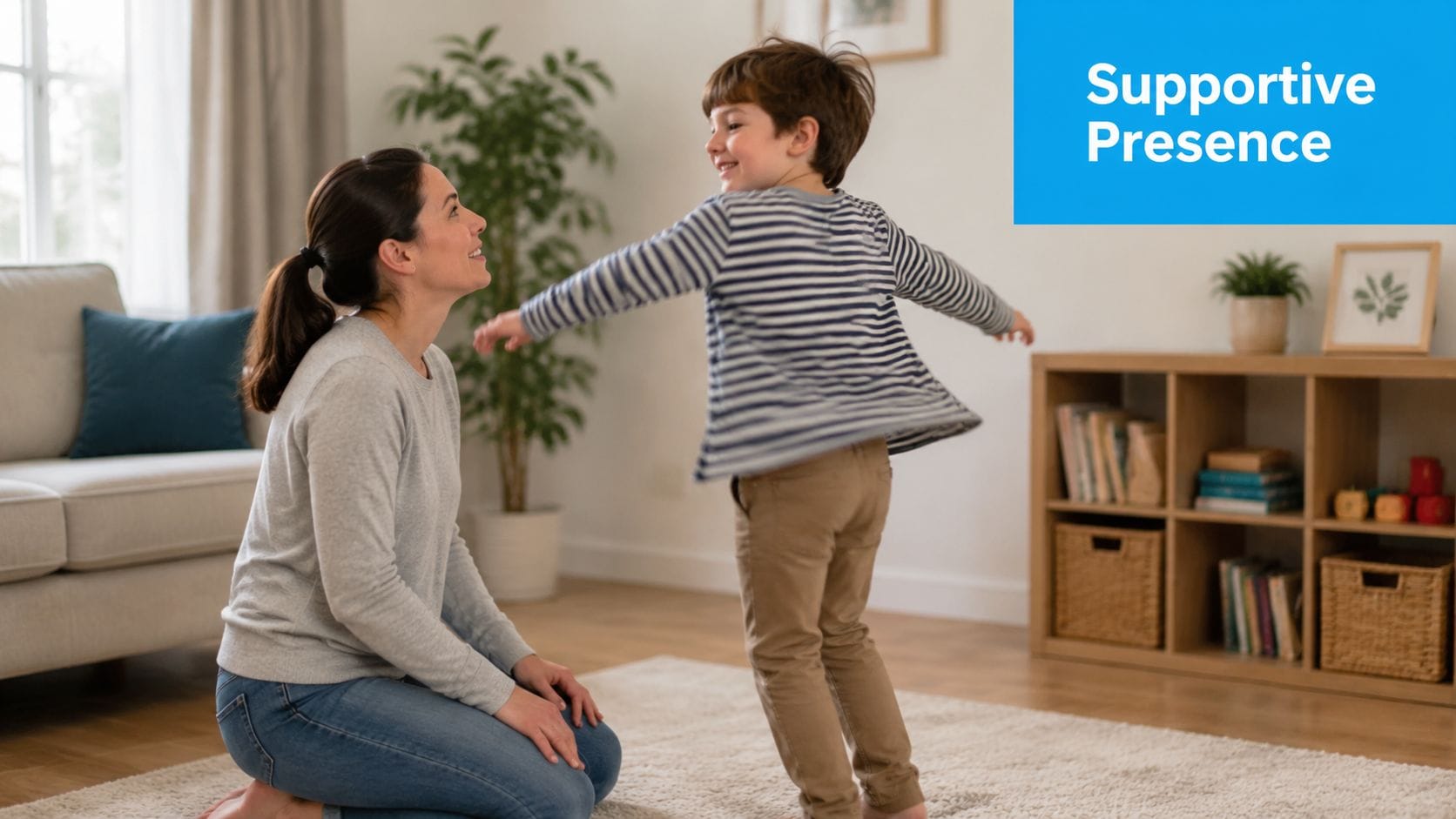 A mother kneeling on a carpet while her young son happily spins with his arms outstretched.