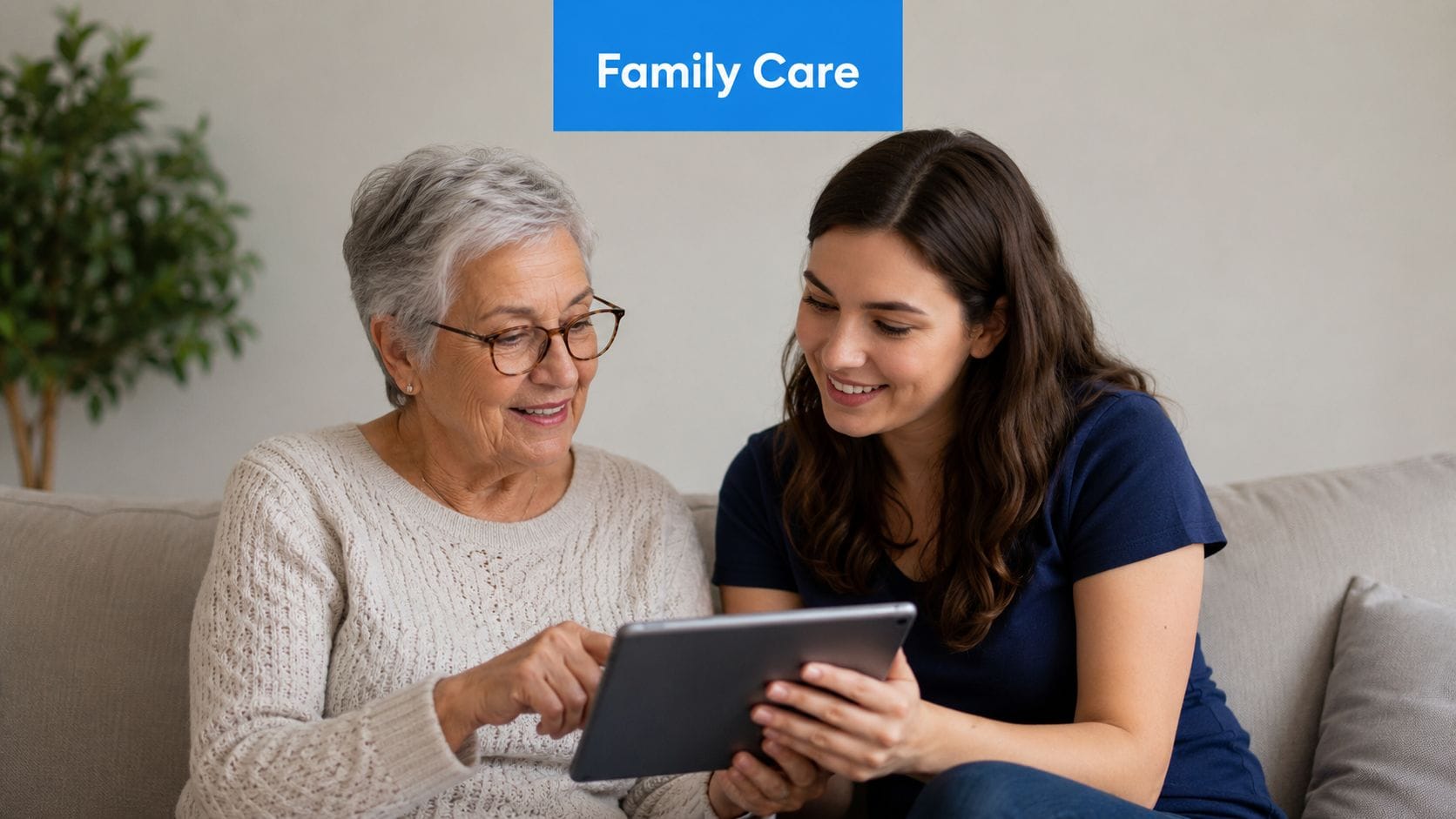 A young woman and an older woman sitting on a couch, looking at a tablet together.