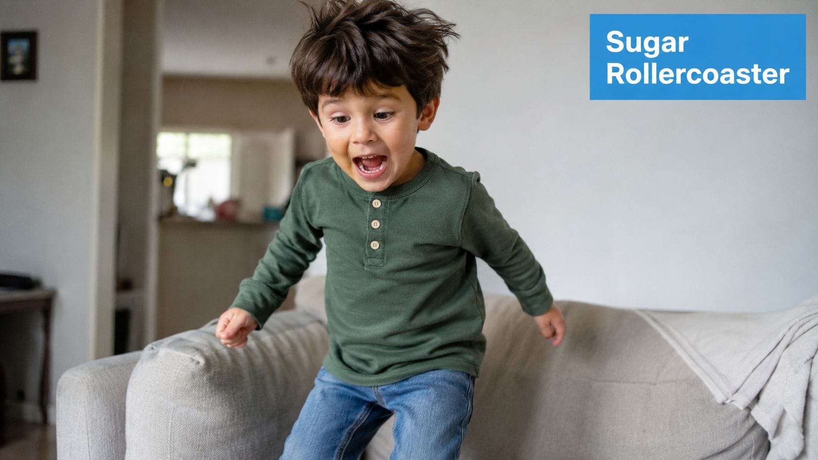 A young boy with messy hair jumping excitedly on a couch, appearing to have a sugar rush.