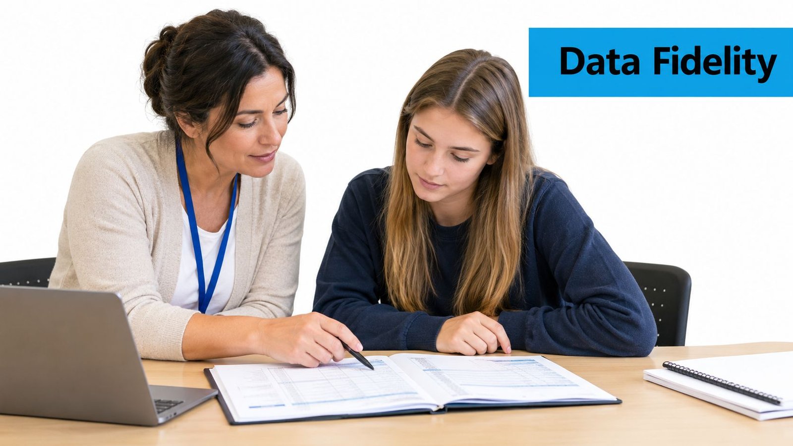 A teacher pointing at a student's data collection document during an instructional training session.
